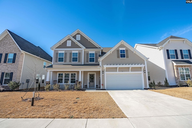 view of front facade with a garage, a front yard, and a porch