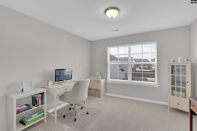 home office with light colored carpet