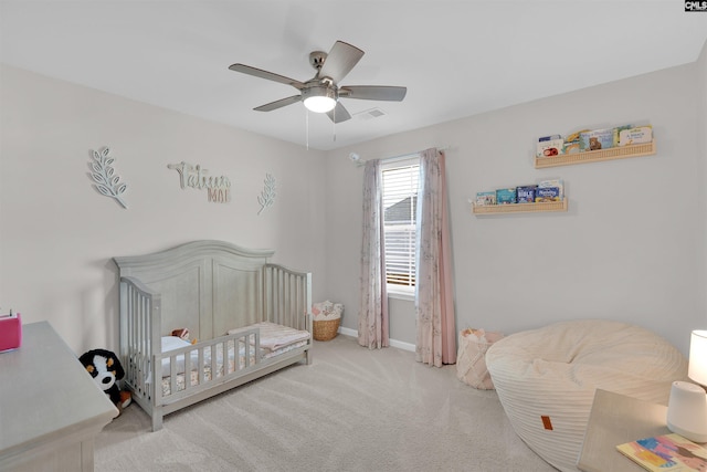 bedroom featuring ceiling fan and light carpet