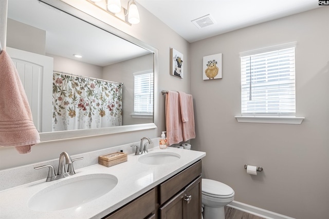 bathroom with vanity and toilet