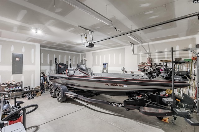 garage with a garage door opener and electric panel