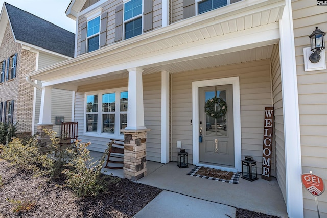 doorway to property featuring covered porch