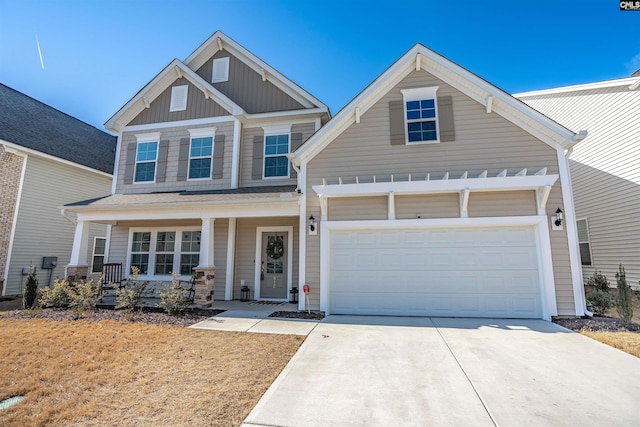 craftsman house with a garage and covered porch