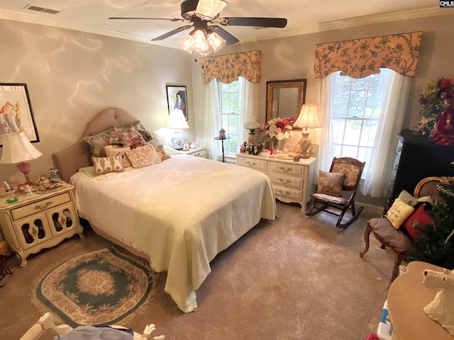 bedroom with ceiling fan, ornamental molding, and light carpet