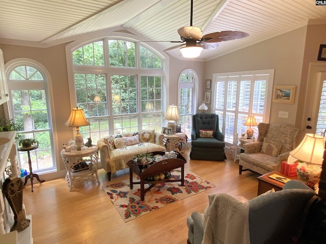 living room with wood ceiling, vaulted ceiling, ceiling fan, and light wood-type flooring