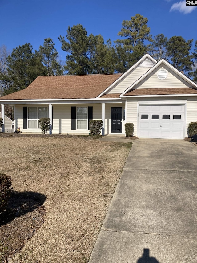 ranch-style house with a garage and a front yard