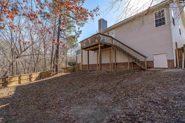 back of property with a wooden deck