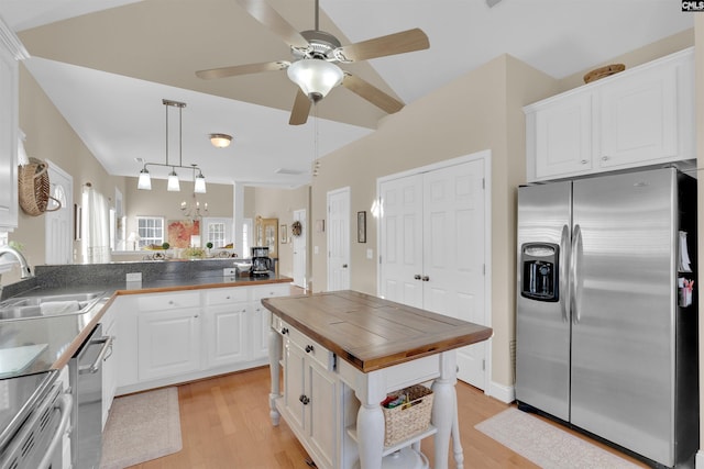 kitchen with white cabinetry, sink, stainless steel appliances, and kitchen peninsula