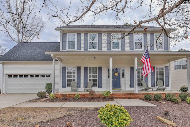 view of front facade featuring a garage and a porch