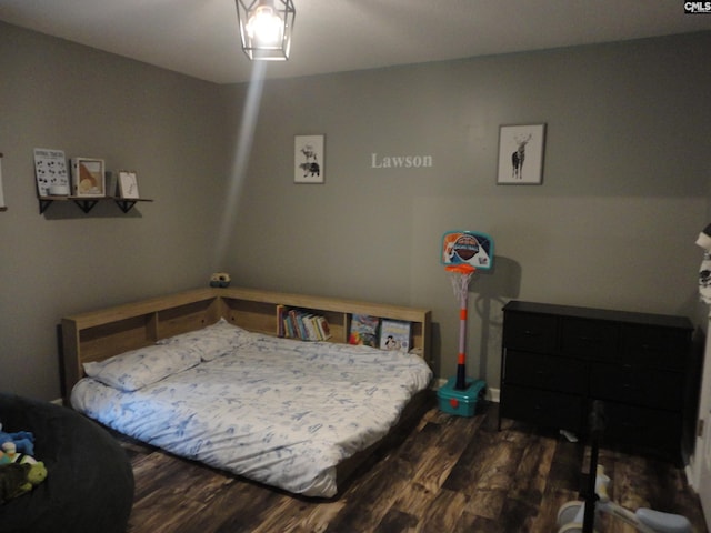 bedroom featuring dark hardwood / wood-style flooring