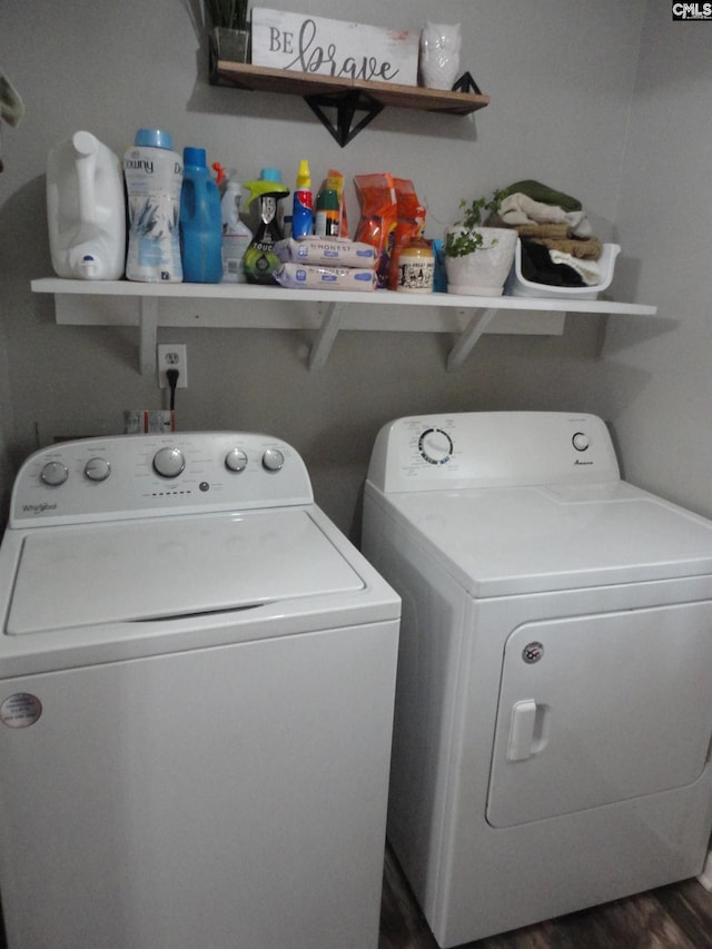 washroom with dark hardwood / wood-style flooring and separate washer and dryer