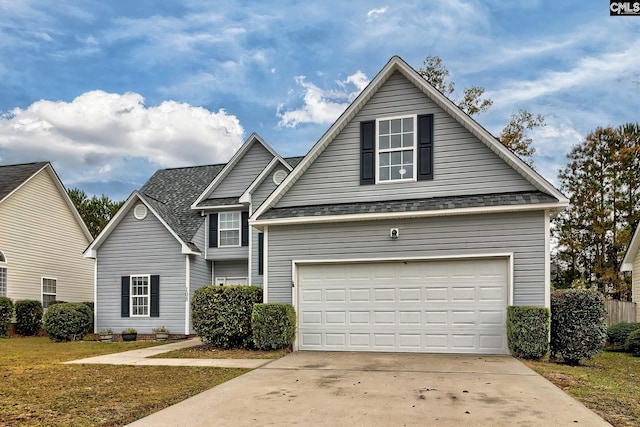 view of front facade with a garage and a front yard