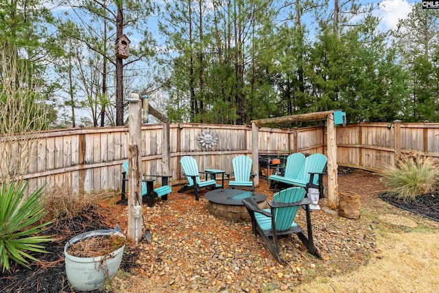 view of yard with a fire pit