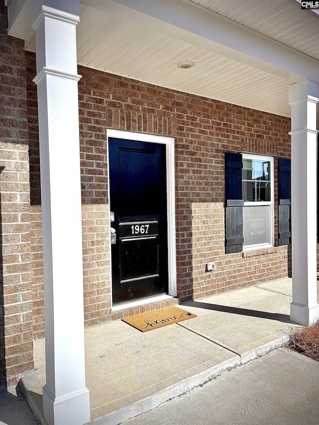 property entrance featuring covered porch