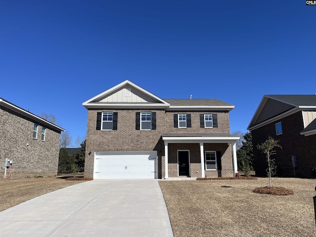 view of front of property with a garage and a porch