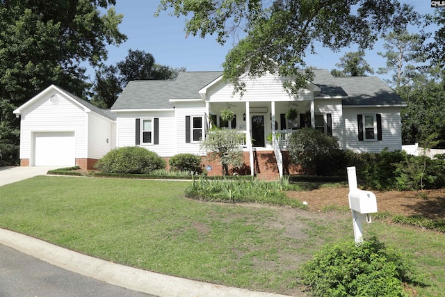 view of front of house with a garage, covered porch, and a front lawn