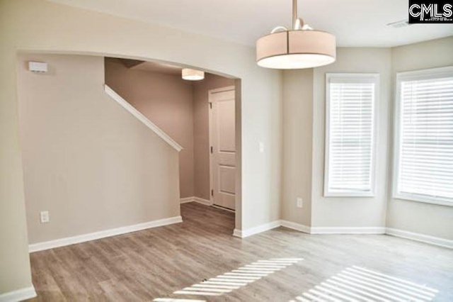 spare room featuring light wood-type flooring