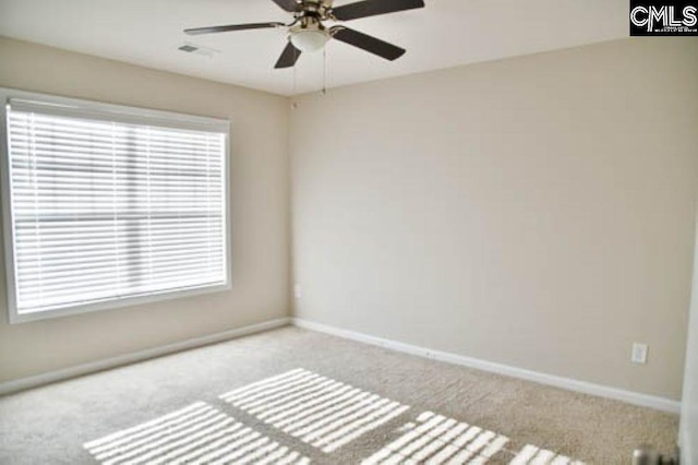 carpeted empty room featuring ceiling fan