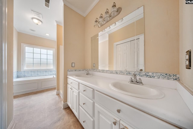 bathroom with ornamental molding, a bath, and vanity