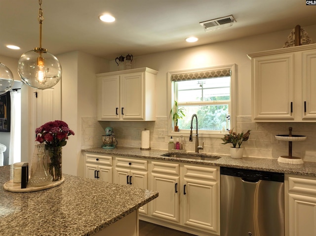 kitchen with white cabinetry, dishwasher, sink, and light stone counters