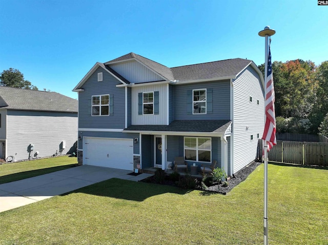 view of property featuring a garage and a front yard