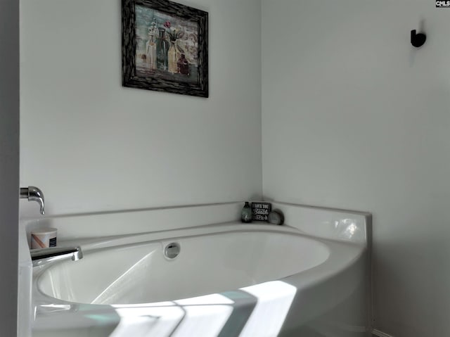 bathroom featuring a tub to relax in