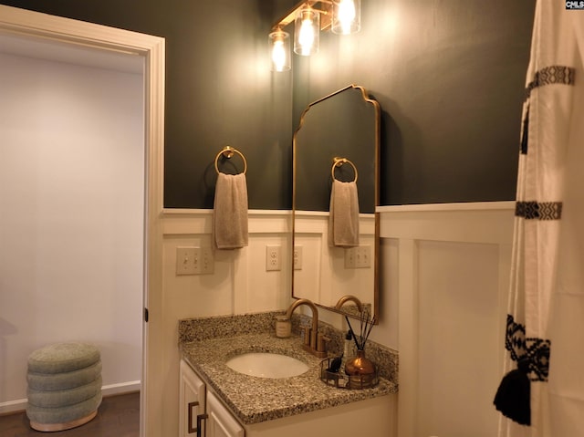 bathroom featuring vanity and hardwood / wood-style floors