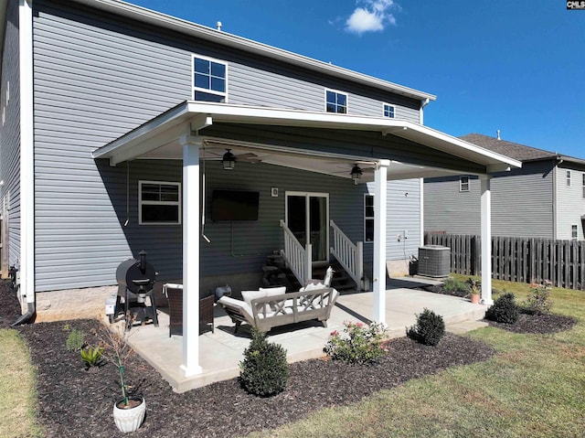 back of house featuring a patio, an outdoor hangout area, central AC unit, and ceiling fan