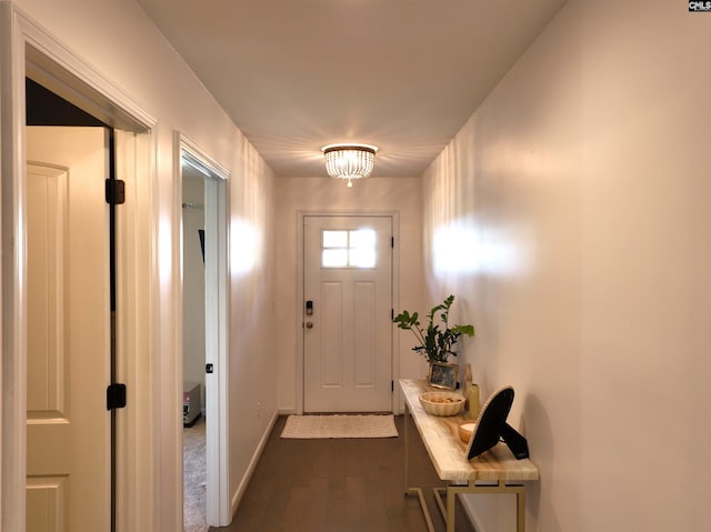 doorway with dark hardwood / wood-style floors