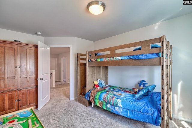 bedroom featuring light carpet