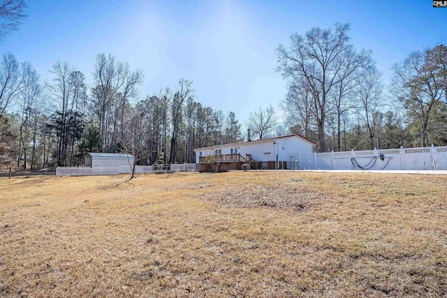 view of yard featuring a wooden deck