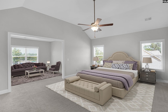 carpeted bedroom featuring ceiling fan and high vaulted ceiling