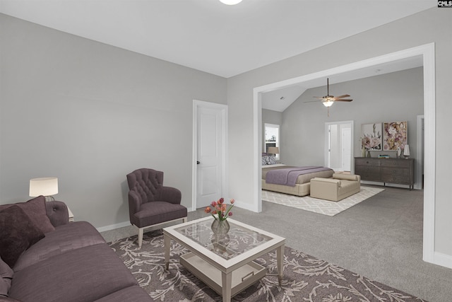 carpeted living room featuring lofted ceiling