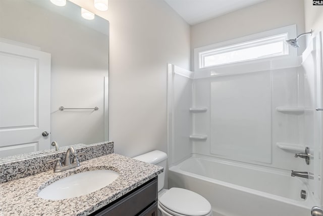 full bathroom with washtub / shower combination, vanity, and toilet