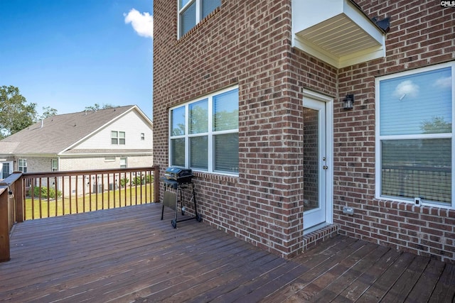 wooden terrace with area for grilling