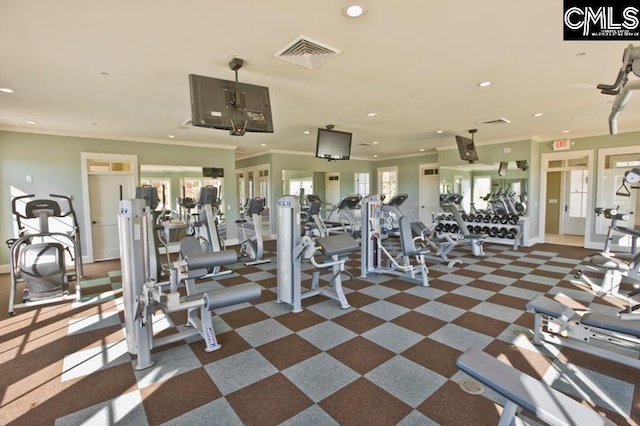 exercise room featuring dark colored carpet and ornamental molding