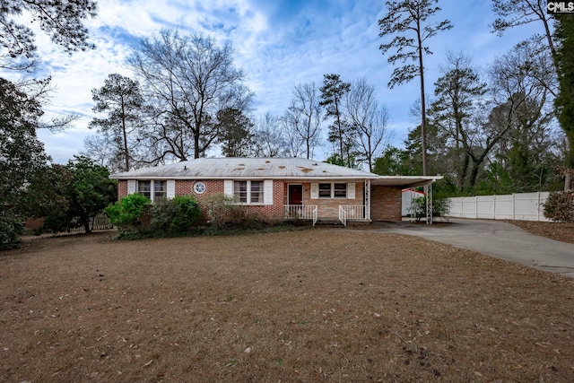 view of front facade with a carport