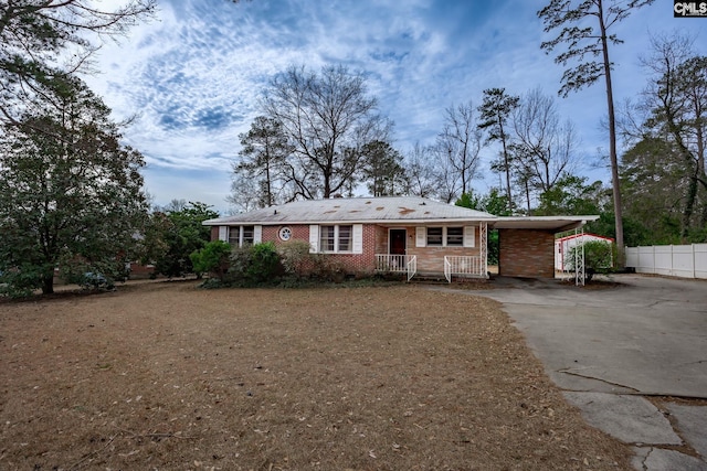 single story home featuring a carport