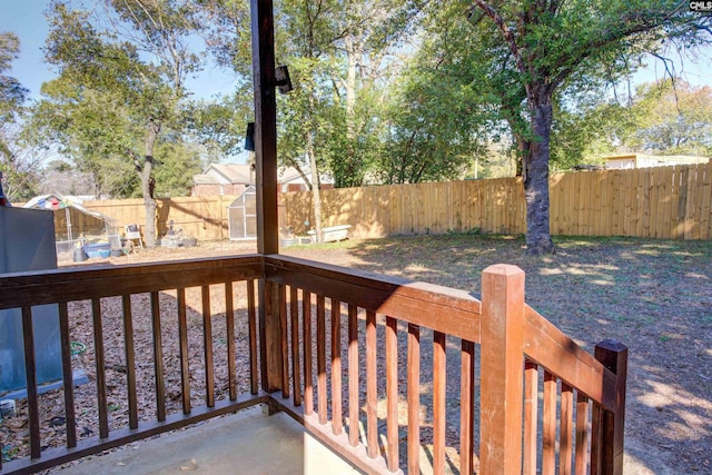 wooden deck with a shed