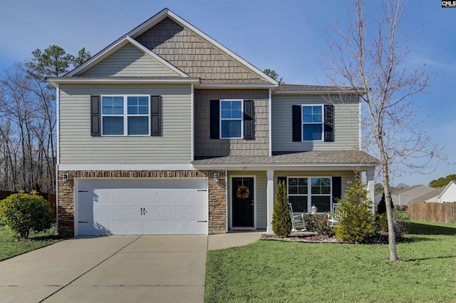 view of front of house with a garage and a front lawn