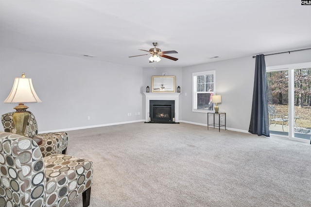 unfurnished room featuring carpet floors and ceiling fan