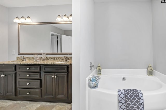 bathroom featuring vanity and a tub