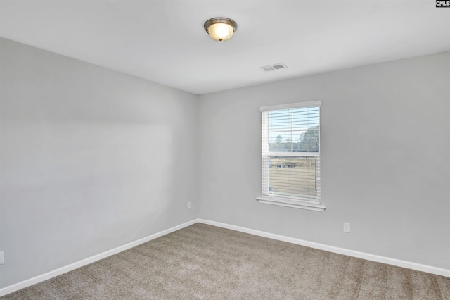 unfurnished room featuring carpet