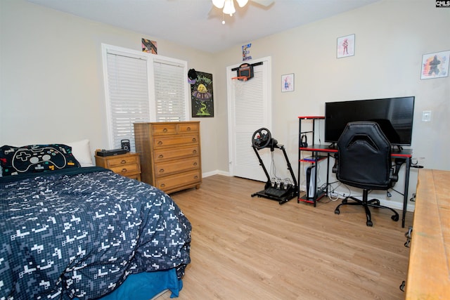 bedroom with hardwood / wood-style flooring and ceiling fan