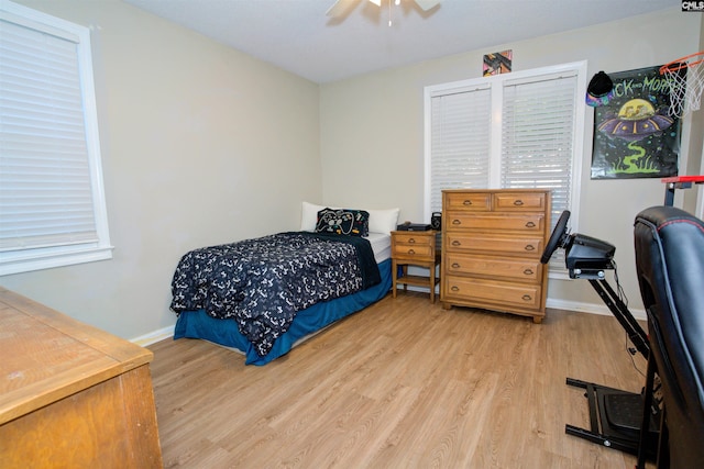 bedroom featuring ceiling fan and light hardwood / wood-style flooring