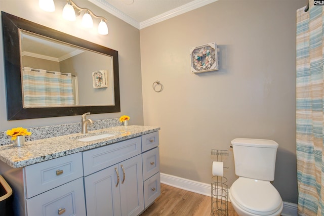 bathroom featuring a shower with shower curtain, vanity, wood-type flooring, ornamental molding, and toilet