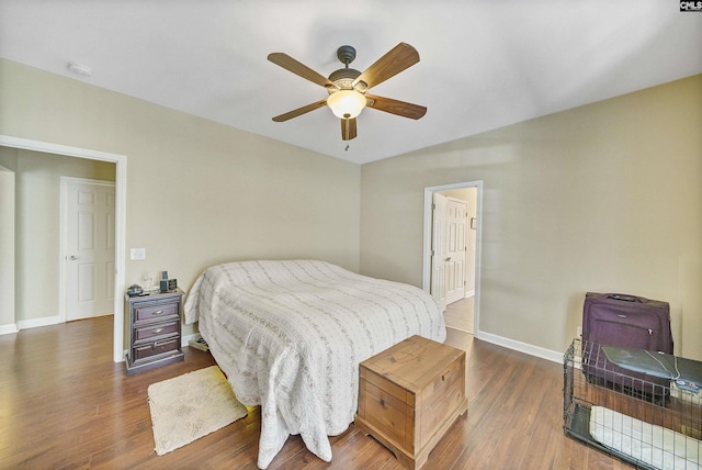 bedroom with dark wood-type flooring and ceiling fan