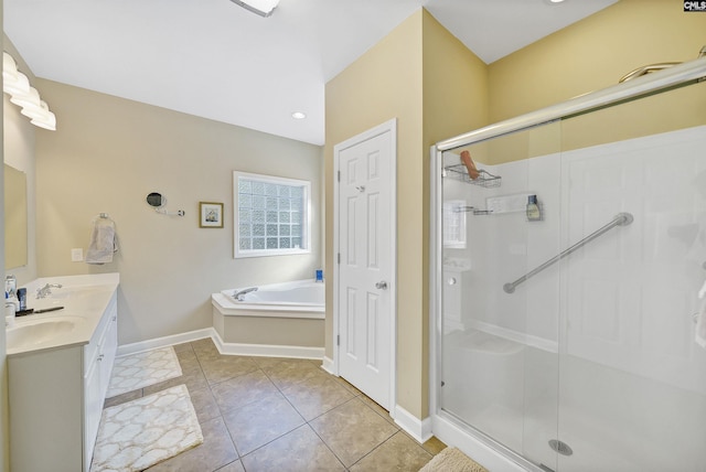 bathroom featuring plus walk in shower, tile patterned floors, and vanity