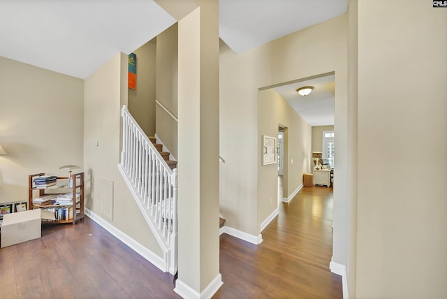 stairs featuring hardwood / wood-style flooring