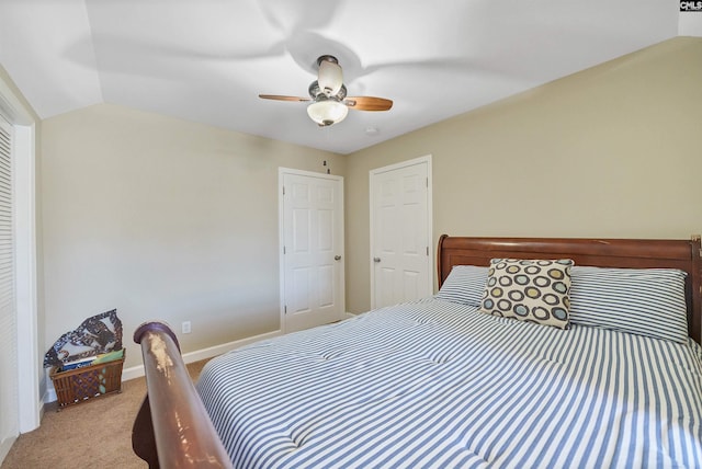 carpeted bedroom featuring ceiling fan and lofted ceiling